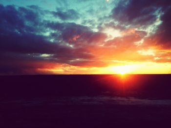 View of calm sea at sunset