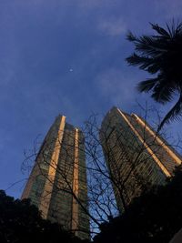 Low angle view of buildings against sky at dusk