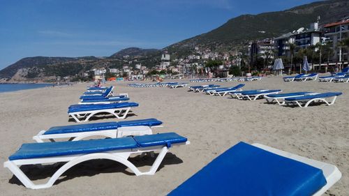 Blue lounge chairs at beach