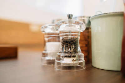 Close-up of glass of jar on table at home