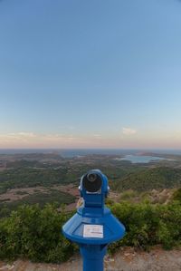 Scenic view of landscape against blue sky