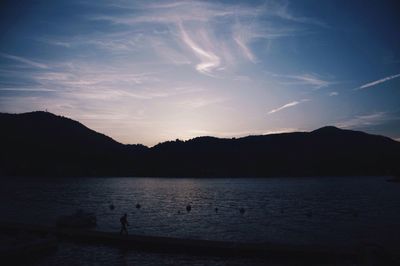 Scenic view of lake at sunset