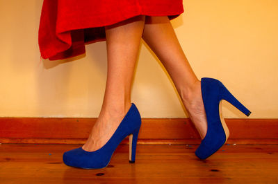 Low section of woman in high heels