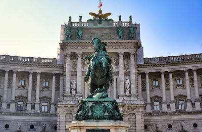 Low angle view of statue against sky