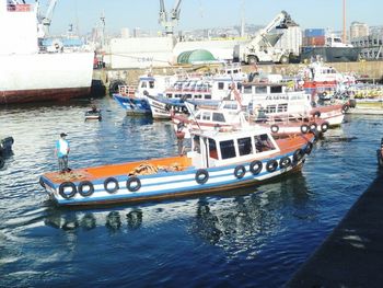 Boats moored at harbor