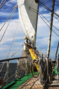 Low angle view of sailboat sailing on sea against sky