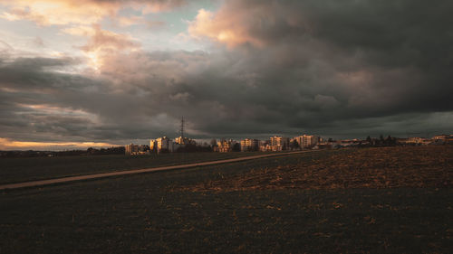 Railroad tracks against sky during sunset