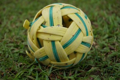 High angle view of yellow container on field