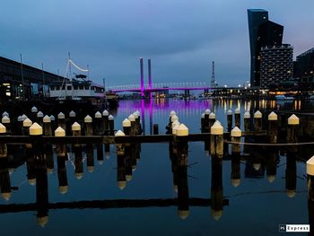 View of bridge over river at dusk