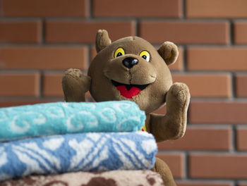 Close-up of stuffed toy against wall