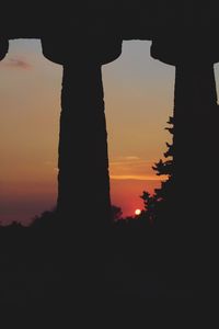 Silhouette trees against sky during sunset