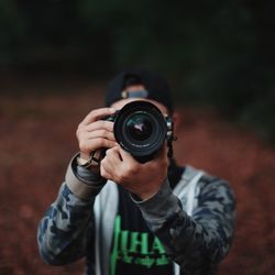 Close-up of photographer photographing