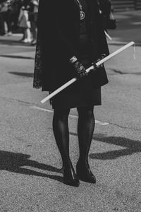 Low section of women walking on street