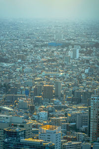 High angle view of city buildings against sky