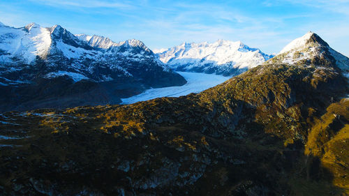 Scenic view of snowcapped mountains against sky