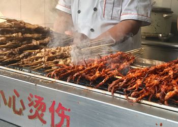 Man preparing food for sale in market
