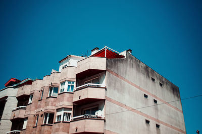 Low angle view of building against blue sky