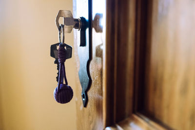 Door of a rural hotel room, with the key in the lock.