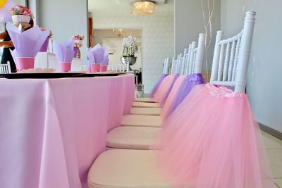 Pink and purple decor on table and chairs