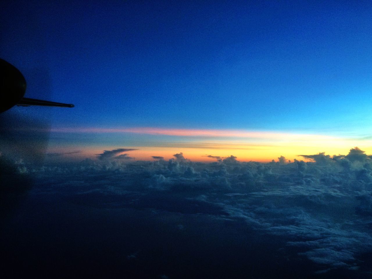 sunset, scenics, beauty in nature, blue, sky, tranquil scene, copy space, tranquility, nature, landscape, dusk, orange color, idyllic, airplane, cloud - sky, transportation, weather, air vehicle, mountain, winter