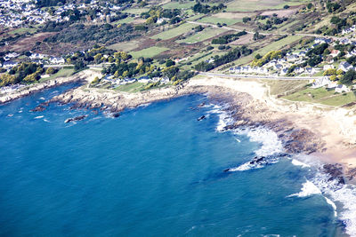 Aerial view of beach and sea against sky