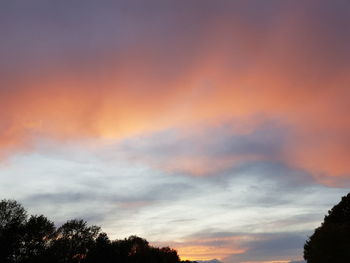 Low angle view of dramatic sky during sunset