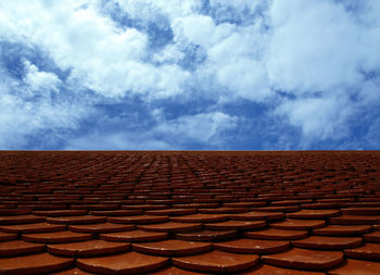 Scenic view of roof tiles against sky