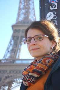 Portrait of smiling woman against eiffel tower