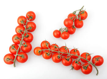 Close-up of cherries against white background