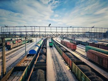 Train on bridge against sky