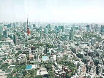 High angle view of modern buildings in city against sky