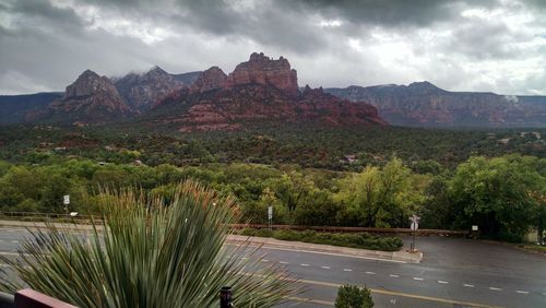 Scenic view of mountains against cloudy sky