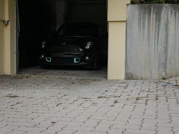 Car on street amidst buildings