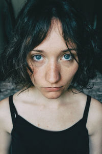 Close-up portrait of woman at home