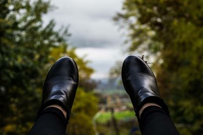 Low section of man against trees