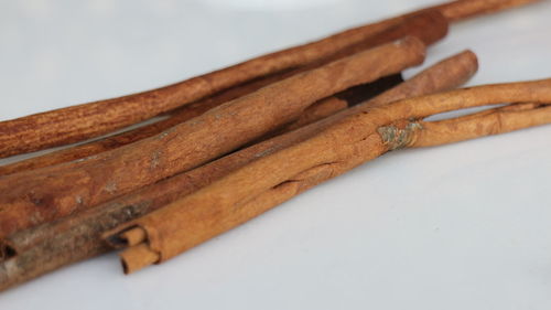 Close-up of wooden plank over white background