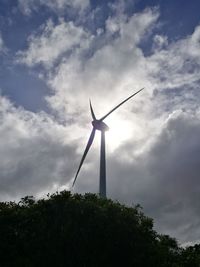 Low angle view of wind turbine against sky