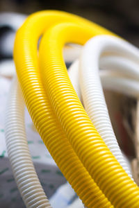 Close-up of white and yellow pipes