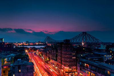 High angle view of illuminated city at dusk