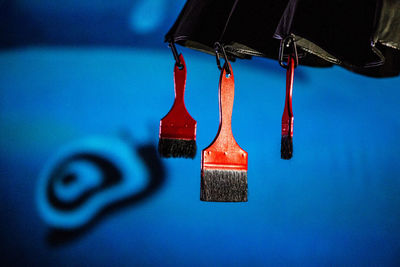 Close-up of blue hanging on wall