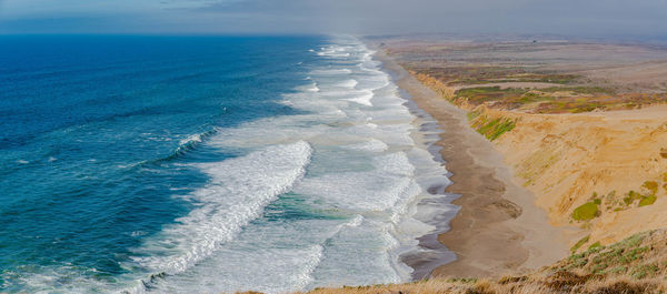 Panoramic view of beach against sky