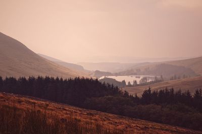 Scenic view of landscape against sky during sunset