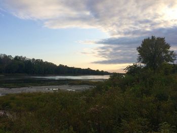 Scenic view of lake against sky during sunset