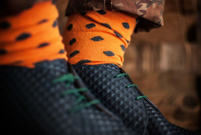 Close up of man wearing colorful socks