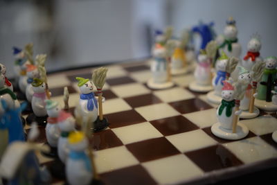 Close-up of chess pieces on table