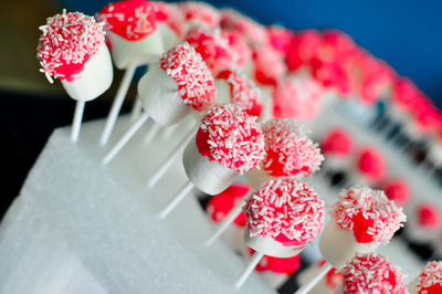 Marshmallow dipped chocolate and sprinkled with white hocolate rice.