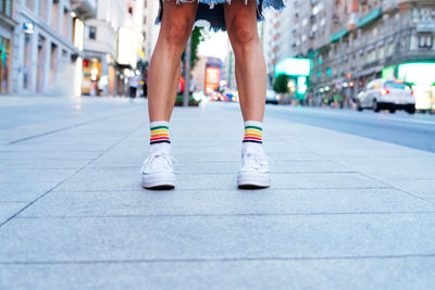 Women's legs in slippers, in the city.