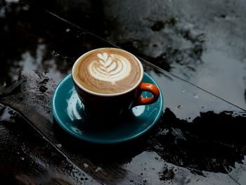 High angle view of cappuccino on table