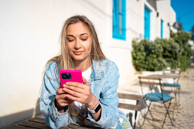 Young woman using mobile phone