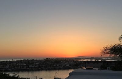 Scenic view of sea against clear sky during sunset